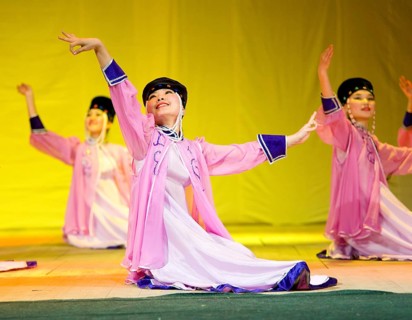 ULAN-UDE, RUSSIA - APRIL 16: Unidentified Buryat female dancers in national dresses perform at