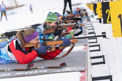 Kamchatka sportswoman biathlete Valentina Vakhrusheva rifle shooting in prone position. Biathlete
