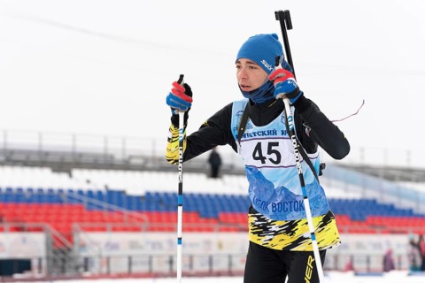 Kamchatka sportsman biathlete Storonkin Nikita skiing on distance biathlon stadium. Open regional