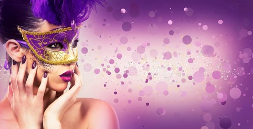 Beautiful woman with dramatic mekaup and pruple lipstick wearing puprle mask. Light background.