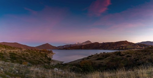 A panorama landscape of Lago di Campotosto in Abruzzo at sunset