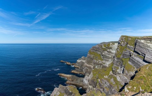 A view of the Kerry Cliffs and Iveragh Peninsula in County Kerry of Ireland
