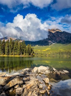 Transparent autumn morning in Jasper National Park, Canada. The woody small island in Pyramid Lake
