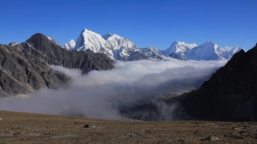 Sea of fog in the Gokyo Valley and snow capped high mountains of the Himalayas, Nepal, Asia