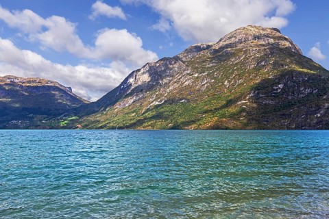 Gerbirgs lake Oppstrynsvatnet in Norway. The greenish-blue colour is caused by clay particles from