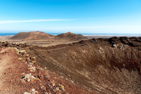 Impressive volcanic landscape with dry craters and vast skies in a natural setting. Beautiful