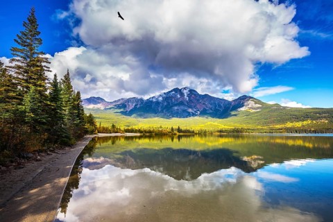 Frosty morning in the Rocky Mountains, Canada. Pyramid Mountain reflected in the smooth water of