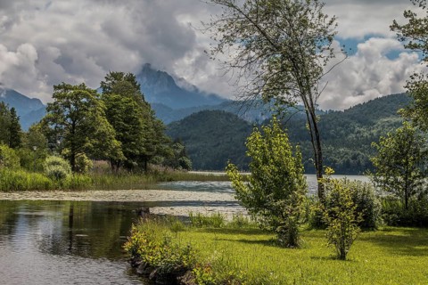 Lake Weissensee to the west of Füssen in the district of Ostallgäu, with the Ammergau Alps and the
