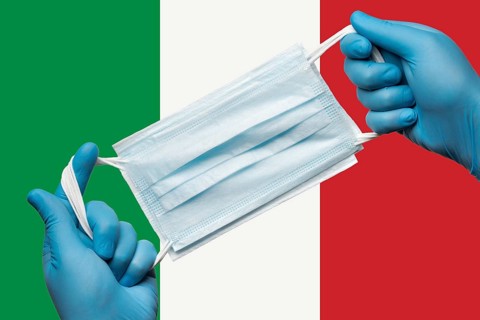 Medic holding respiratory face mask in hands in blue gloves on background flag of Italy or Italian