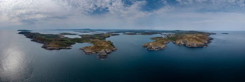 A wide panorama landscape of the islands and coastline of Baltimore Harbor in West Cork County in