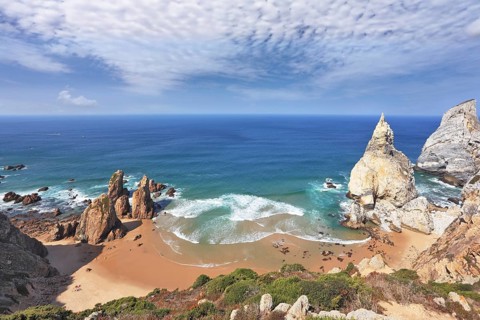 Atlantic coast of Portugal. Two picturesque cliffs of white sandstone cliffs of red sandstone on