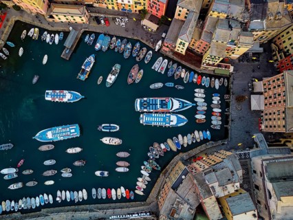 Tourist boat mooring in the harbor of Camogli