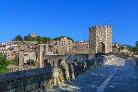 12th-century Romanesque bridge over the Fluvia river in Besalu, Spain, Europe