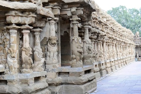 Vishnu Varadaraja Temple, Kanchipuram, Tamil Nadu, row of ornately carved stone pillars in an