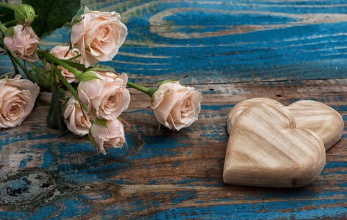 Wooden hearts handmade and roses for the holiday lovers