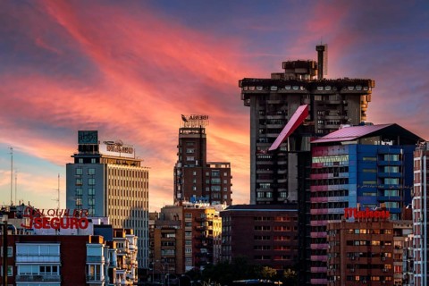 Madrid, Spain, May 22, 2024: Telephoto lens view of Avenue of America area art sunset, Europe