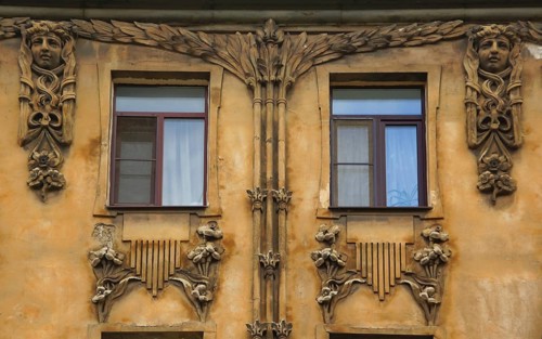 Fragment of the facade with a balcony of an Art Nouveau-style residential building in the city