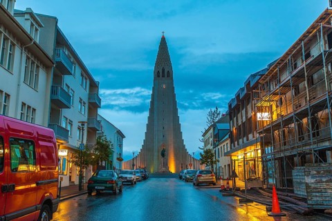 REYKJAVIK, ICELAND, JULY 06::View down a street of illuminated buildings of Hallgrimskirkja church,