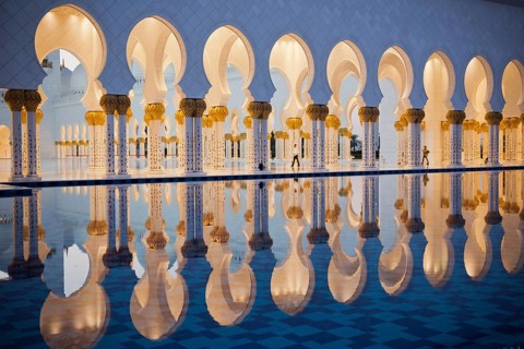 Beautiful gallery of famous Sheikh Zayed White Mosque in Abu Dhabi, UAE. Reflections at sunset