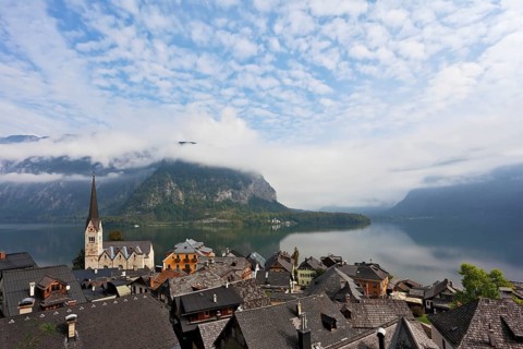 The most picturesque small town in Austria - Hallstatt. Slender bell tower and the church on the