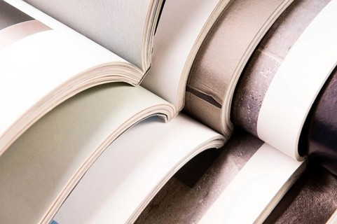 Stack of open magazines