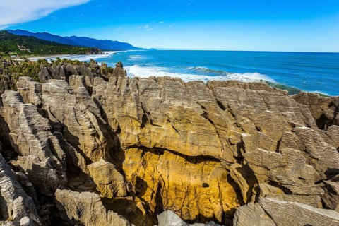 Pancakes Rock is a natural wonder of New Zealand. Paparoa Park. Stone flat pancakes, stacked on top
