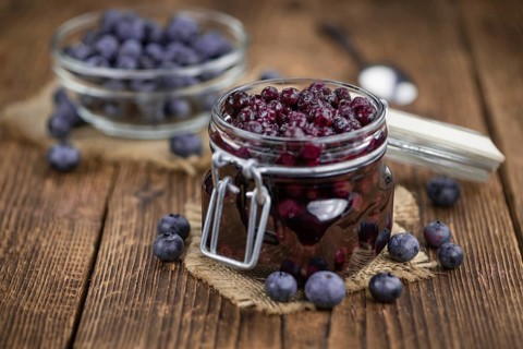Fresh made Blueberries (preserved) on an old and rustic wooden table, selective focus, close-up