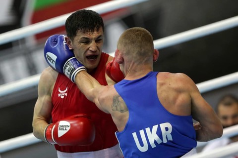 Sofia, Bulgaria. 27th February, 2021. Bobo-Usmon Baturov (red) of Uzbekistan and Yevhenii Barabanov