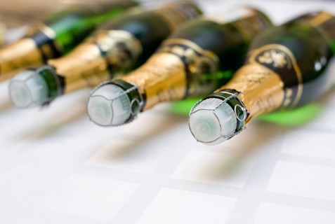 Some bottles of champagne lying on a tray