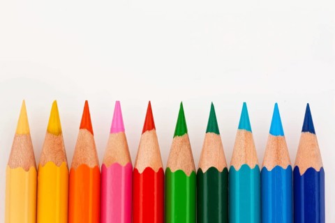 Many different coloured pencils on a white background, Many different colored pencils on white