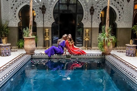 A gorgeous model poses inside a home environment in Medina, Morocco, Africa