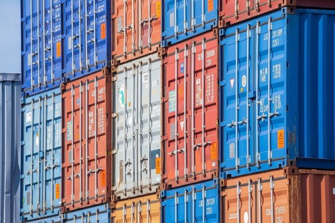 Stacked colourful freight containers at the container terminal in Holz-und Fabrikenhafen, Bremen,