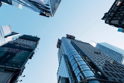 New York City, USA, June 25, 2018: Low angle view of skyscrapers in Times Square in Midtown, North