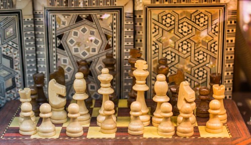 Intellectual game -chess. Wooden chess pieces on the chessboard