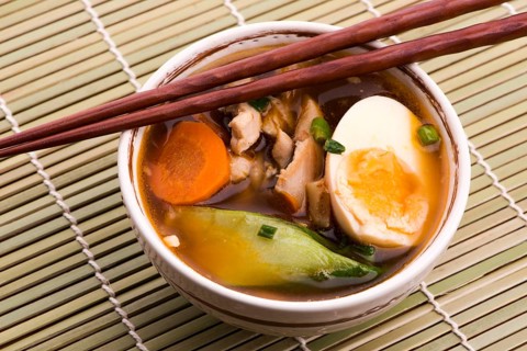 Ramen egg noodle soup dish with salmon fish