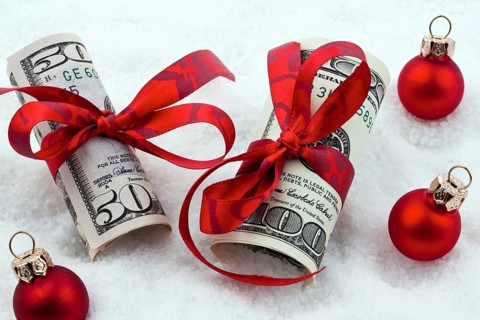 Dollar banknotes with ribbon as a gift of money, Austria, Europe