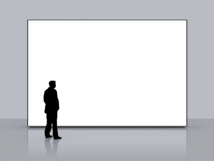 A man in front of a big white empty screen