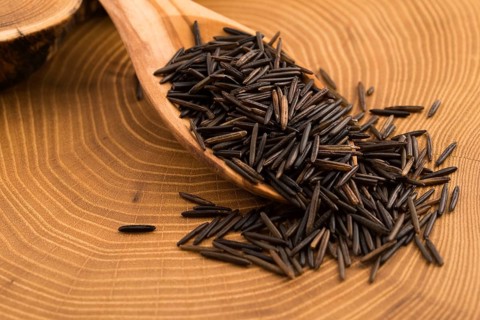 Wild rice on wooden spooon