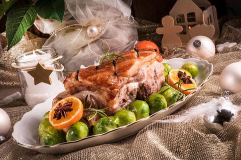 Christmas dinner with brussels sprouts in orange sauce