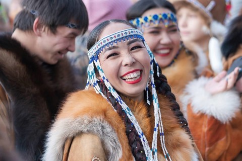 Portrait expression smiling woman in traditional clothing indigenous inhabitants of Kamchatka.