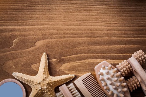 Group of skincare items on brown pine vintage board healthcare concept