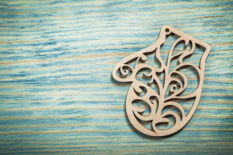 Vintage wooden mitten on wood board holidays concept