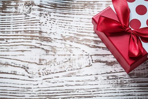 Packed present box on vintage wooden board copy space holidays concept