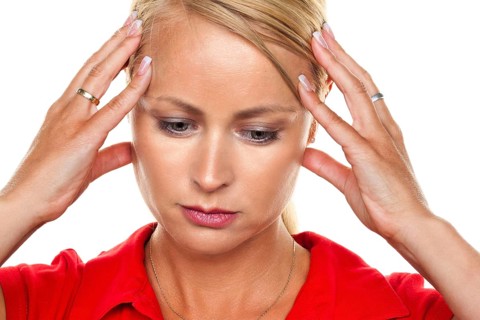 A pensive young blonde woman with a headache and migraine, 25, 30, years Studio shot, Federal