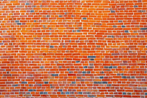 The background of the old red brick wall for design interior and various scenes or as a background