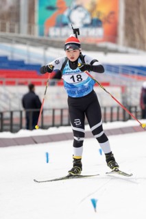 Korean sportswoman biathlete Choi Yoonah skiing on distance biathlon stadium during Open regional