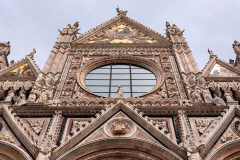 Great gothic portal of the Siena Cathedral in Italy