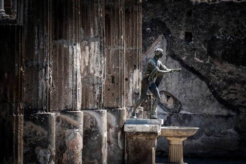 POMPEII, ITALY, MAY 04, 2022, Colonnade and sculptures of the Temple of Apollo near the Pompeian