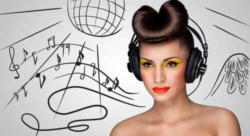 Clubbing fashionable girl in nightclub with big vintage headphones on grey sketchy background of a