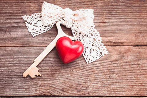 Old intage key and red heart. Key of my heart concept. Valentine's day greetings